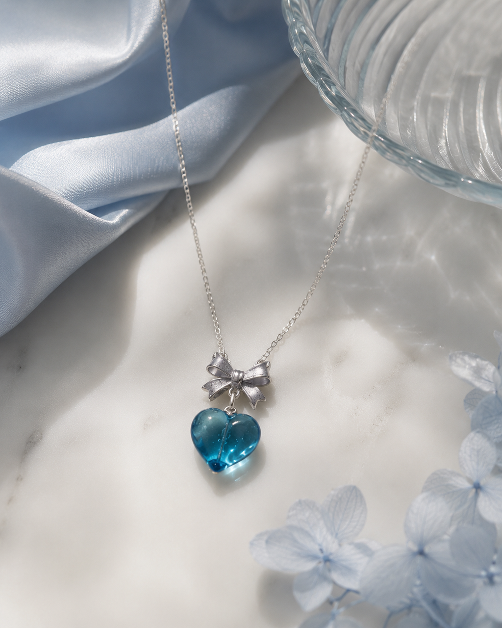 Blue Valentine Bow Necklace with aquamarine heart crystal pendant on silver chain