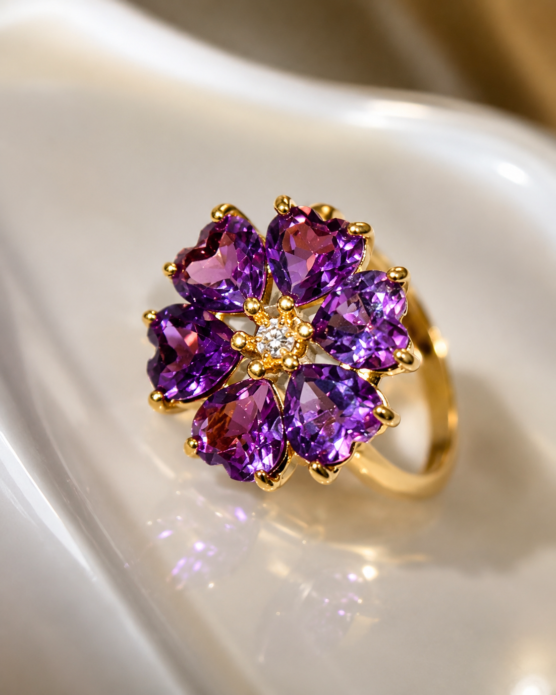 Close-up of the amethyst flower ring on a pearl dish