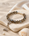 Labradorite & Pearl Bracelet on marble tile with shell