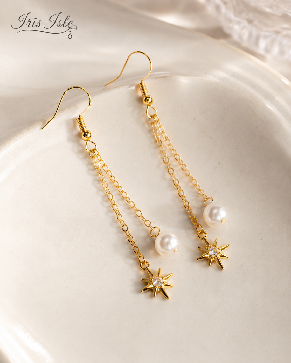 Starlight Pearl Dangle Earrings on ceramic dish