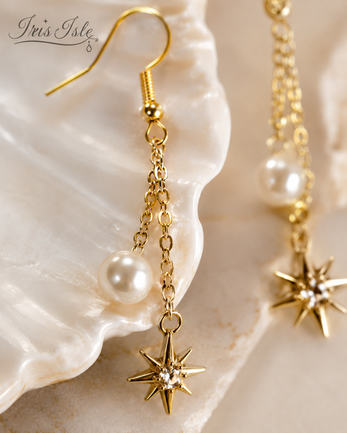 Close-up of gold star charm and pearl drop